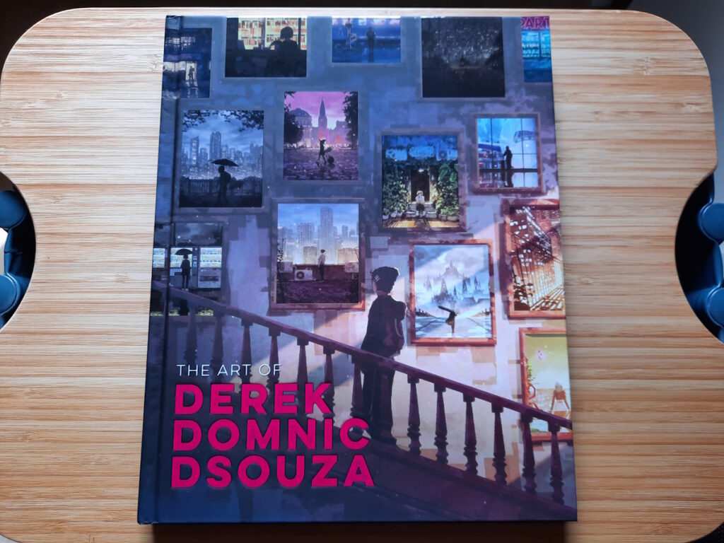 Ein Artbook von Derek Dominic Dsouza. Das Cover zeigt eine schattenhafte Figur auf einer Treppe. An der Wand über der Treppe hängen verschiedene Motive des Künstlers.