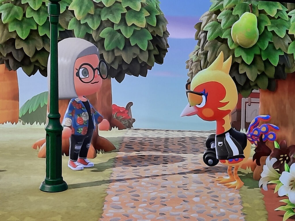 Meine Animal-Crossing-Nachbarin beim Sport, während meine Spielfigur mit großen Augen zuschaut. 